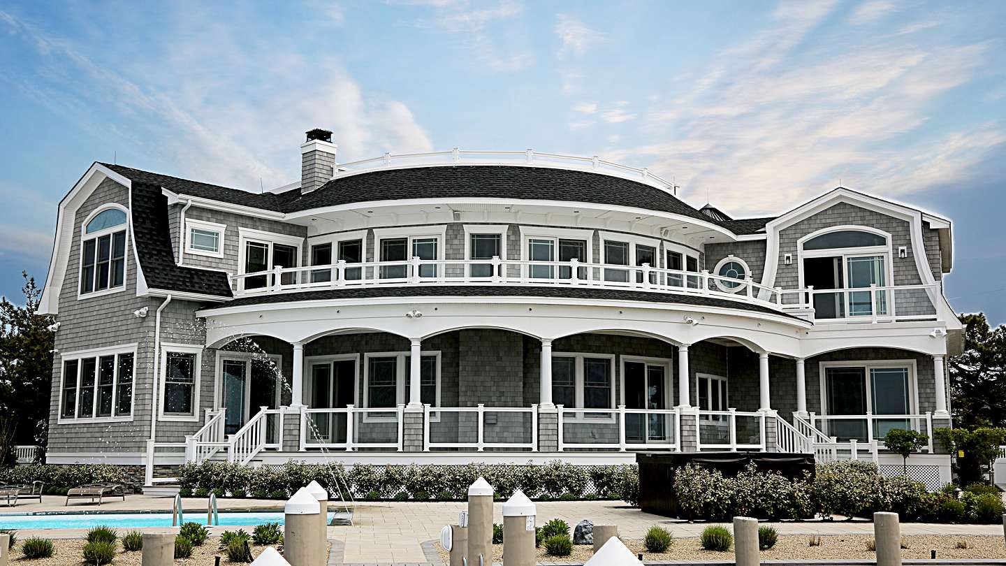 Front elevation of waterfront beach home boasting luxury amenities, Long Beach Island NJ