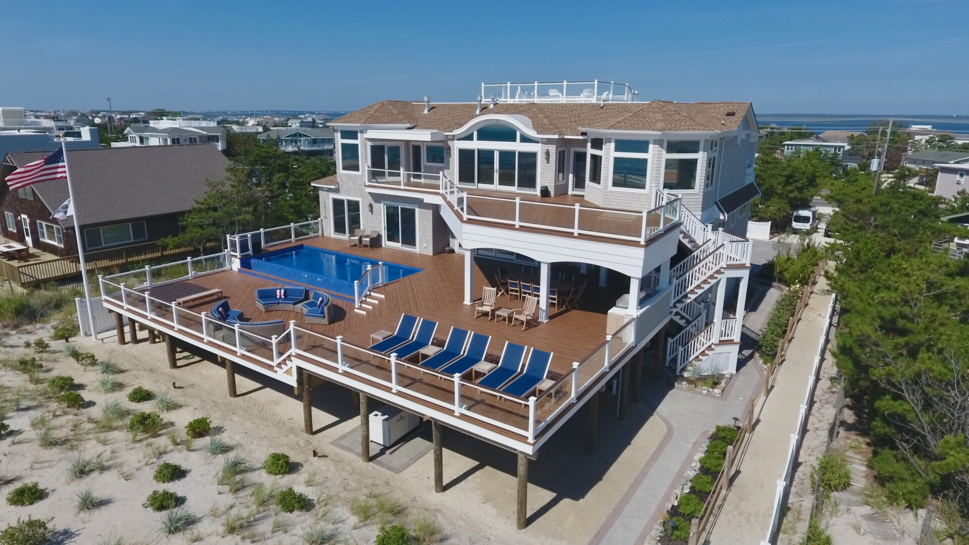 Aerial view of modern beach house boasting an oversized patio, Long Beach Island NJ